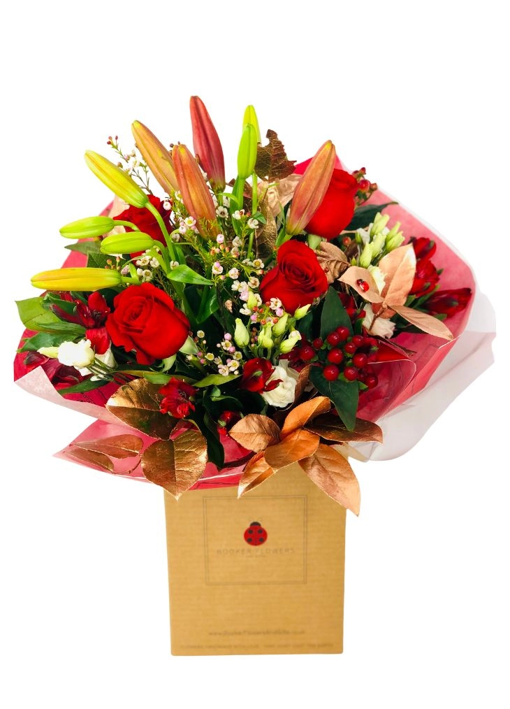 Christmas Enchantment Red Rose and Lily Handtied Christmas Enchantment Red Rose and Lily Handtied