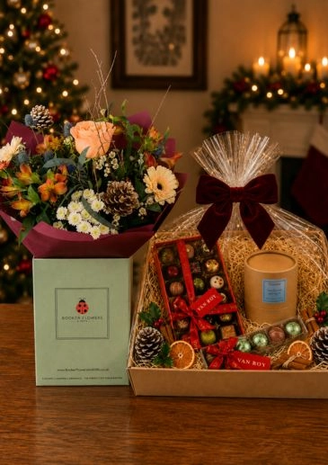 Christmas Sunset Bouquet of Flowers with scented candle and festive Chocolates Hamper Gifts